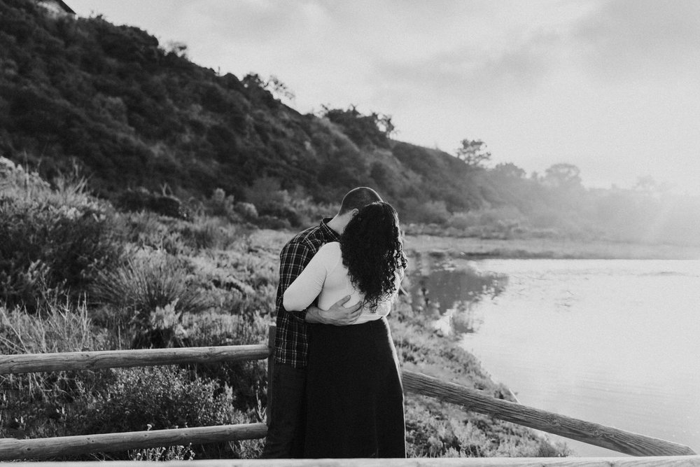 A couple hugging at the San Elijo Lagoon in San Diego, California