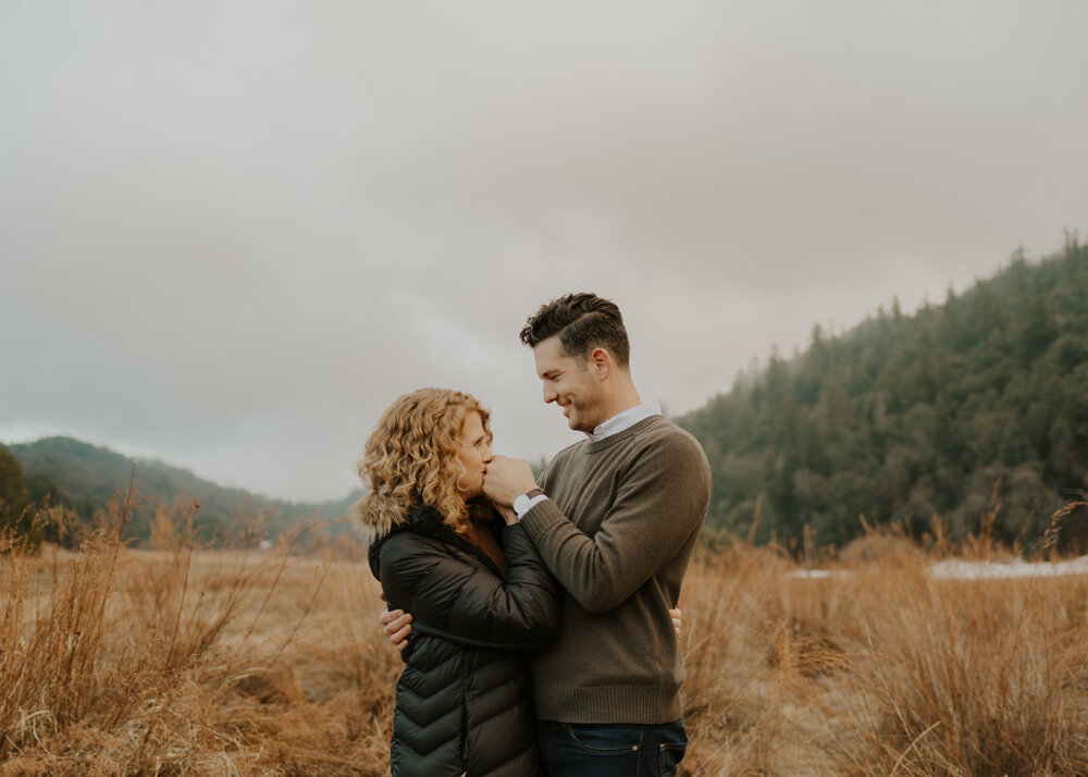 An engaged couple at Doane Pond at Palomar Mountain