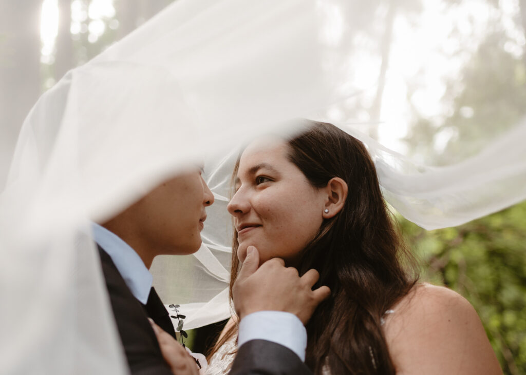A couple embracing during their Big Sur elopement at Pfeiffer Big Sur State Park.