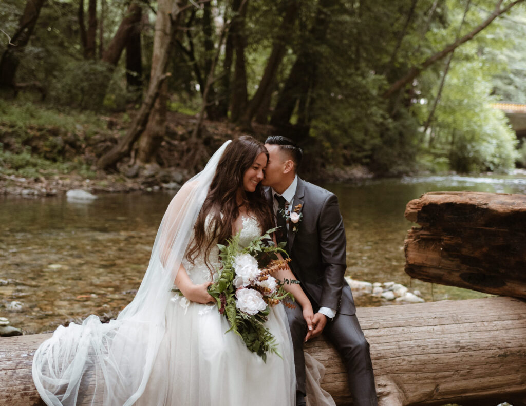 A couple embracing during their Big Sur elopement at Pfeiffer Big Sur State Park.