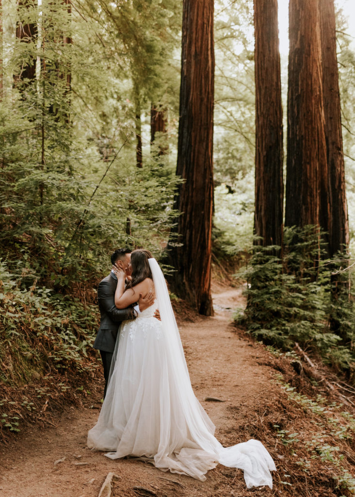 A bride and groom embracing during their elopement in Big Sur.