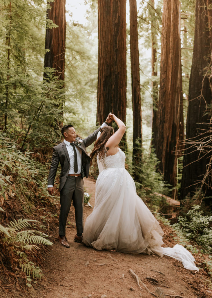 A bride and groom dancing during their elopement in Big Sur.