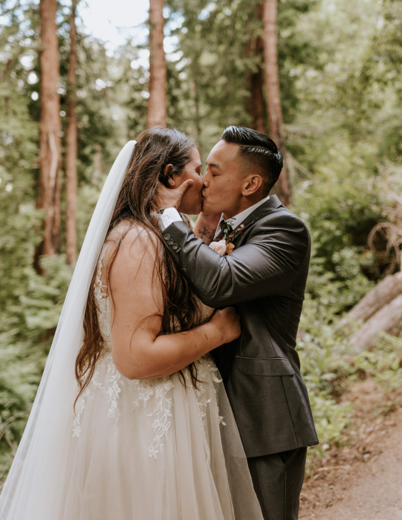 A bride and groom kissing during their elopement at Big Sur.