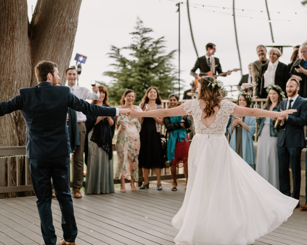 A bride and groom dancing at their wedding at Martin Johnson House in La Jolla, California.