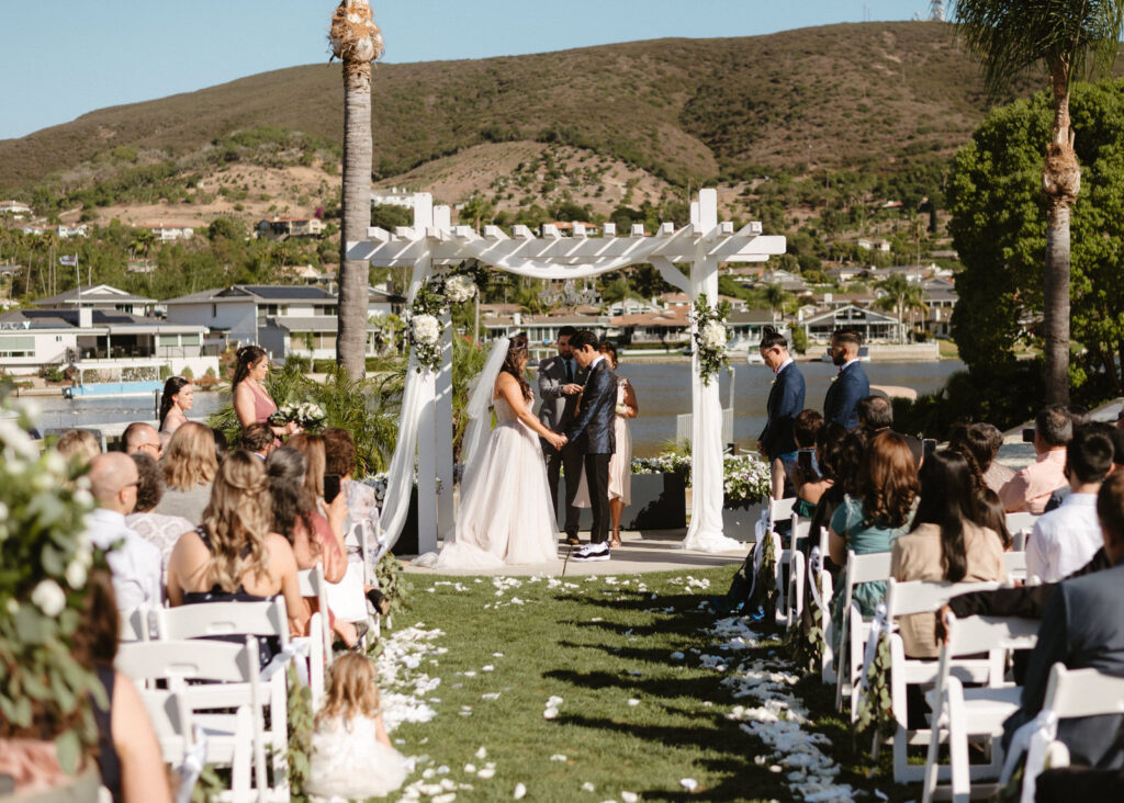A ceremony at this Lakehouse Resort wedding in San Marcos, CA.