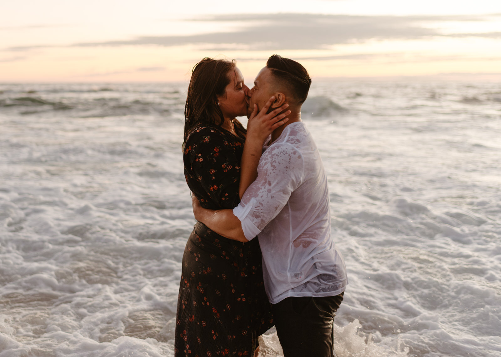 A couple embracing during their Victoria Beach engagement session.